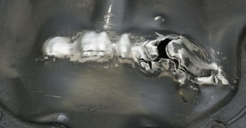 The best method for repairing a cracked engine sump or metal housing